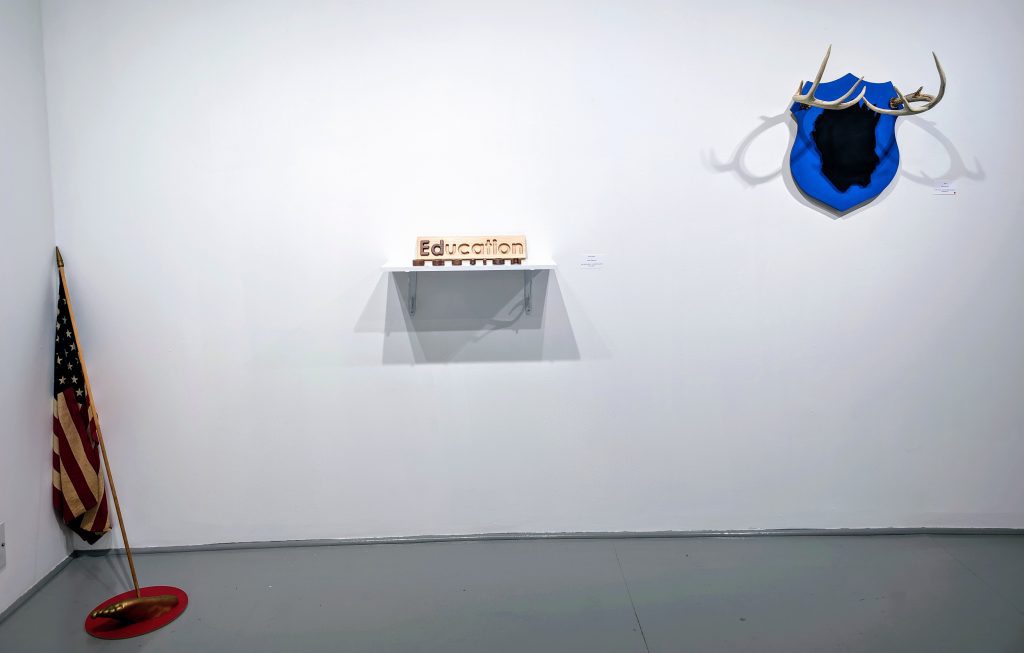 Installation view of Threshold II: Migration Patterns exhibition by Kevin Demery and Andrew Mcilvaine at Gallery Bogart Kansas City, featuring mixed media sculpture exploring Black and Brown cultural identities.