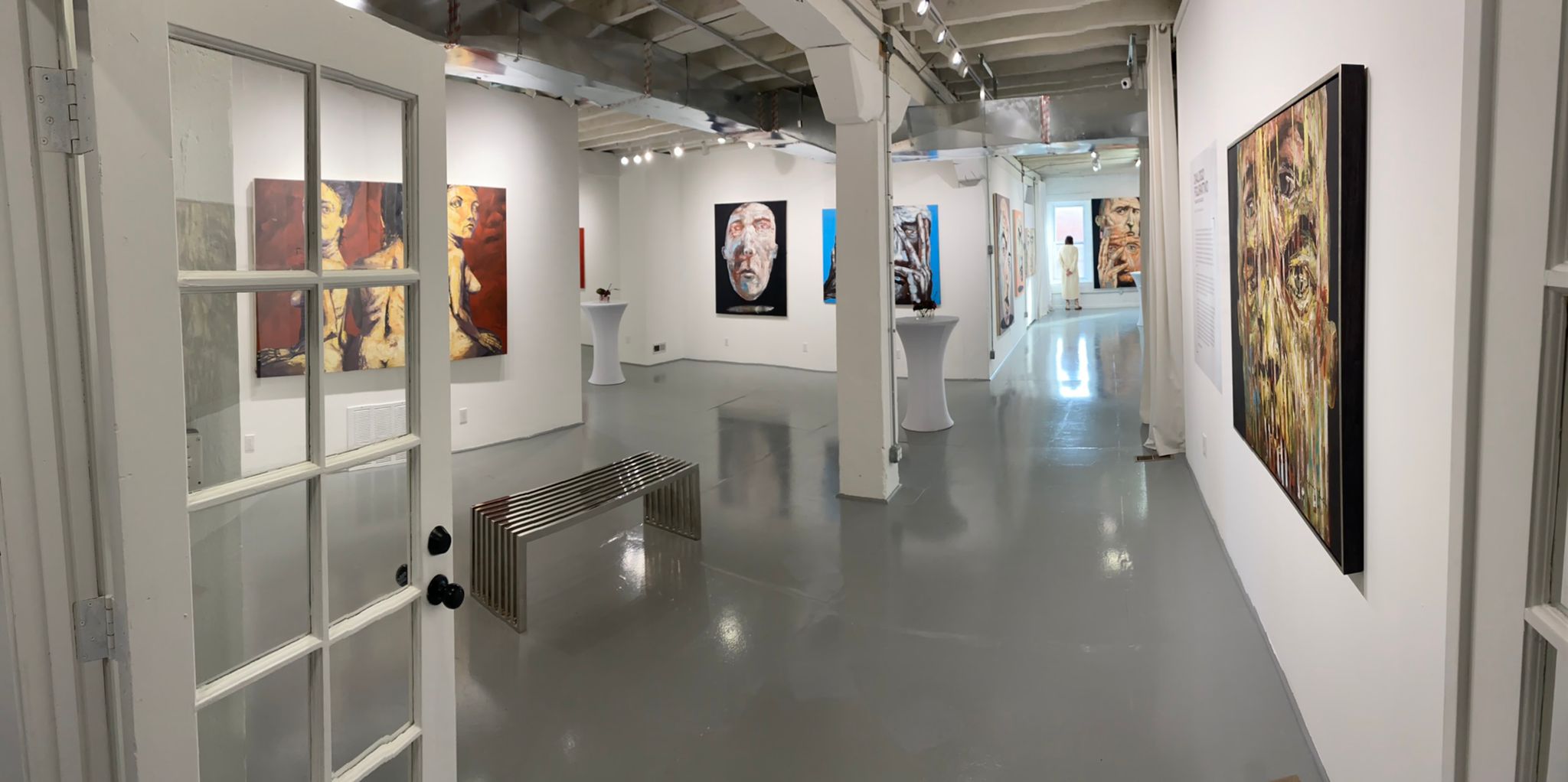 Installation view of Dialogo Figurativo solo exhibition by Abel Massot at Gallery Bogart Kansas City, featuring large-scale contemporary Latin American figurative paintings.